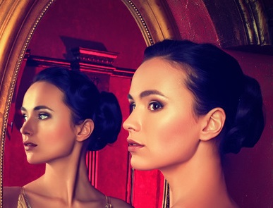 Woman looking in mirror