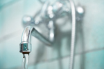 Image of water pouring from a faucet